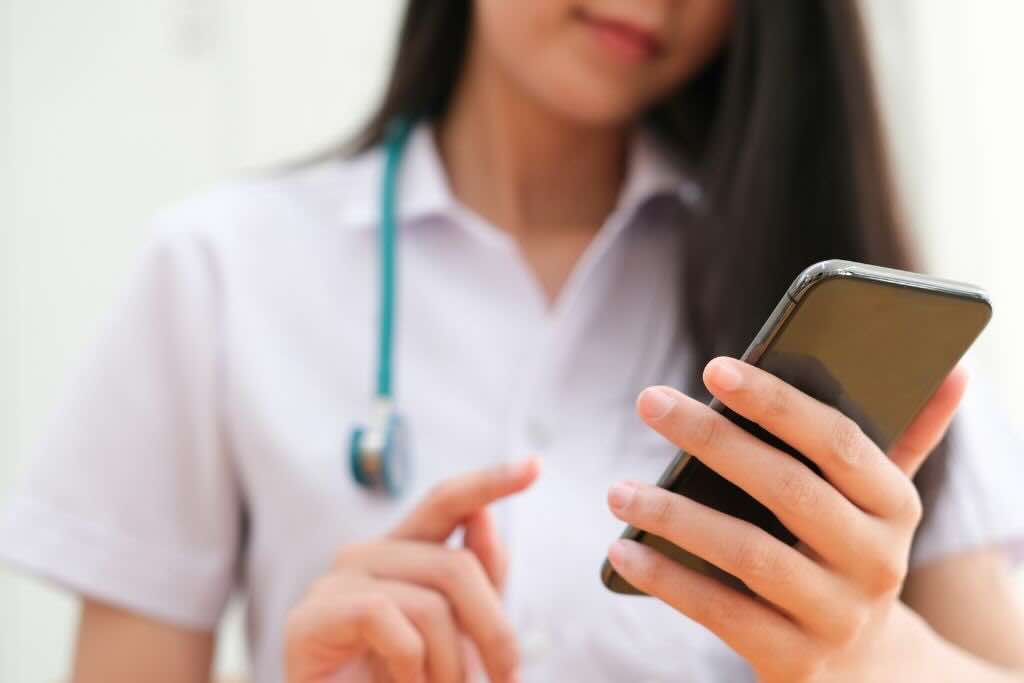 Evoke Health blog image with phone using a phone