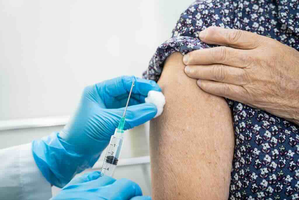 Evoke Health blog image with a resident receiving vaccine
