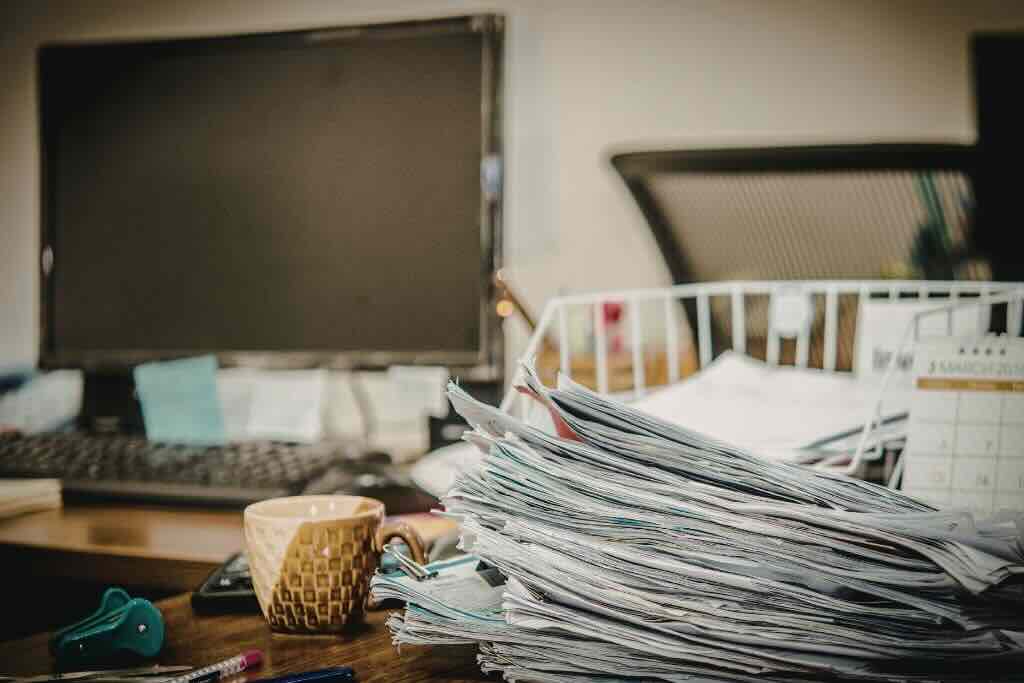 Evoke Health blog image with stacks of paper