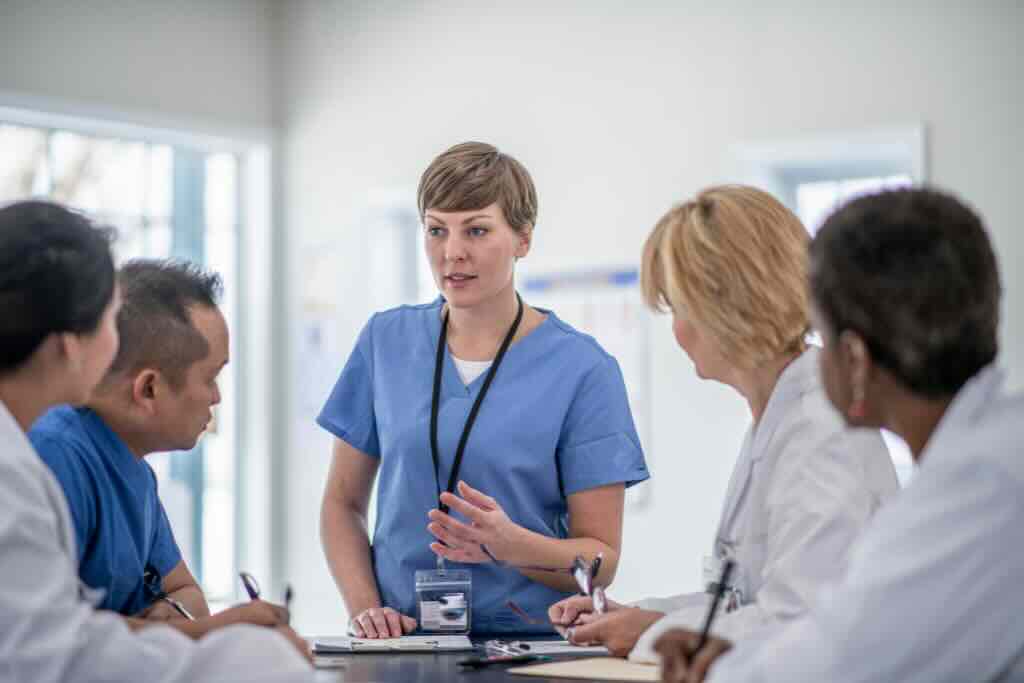 Evoke Health blog image with clinical team having a roundtable discussion